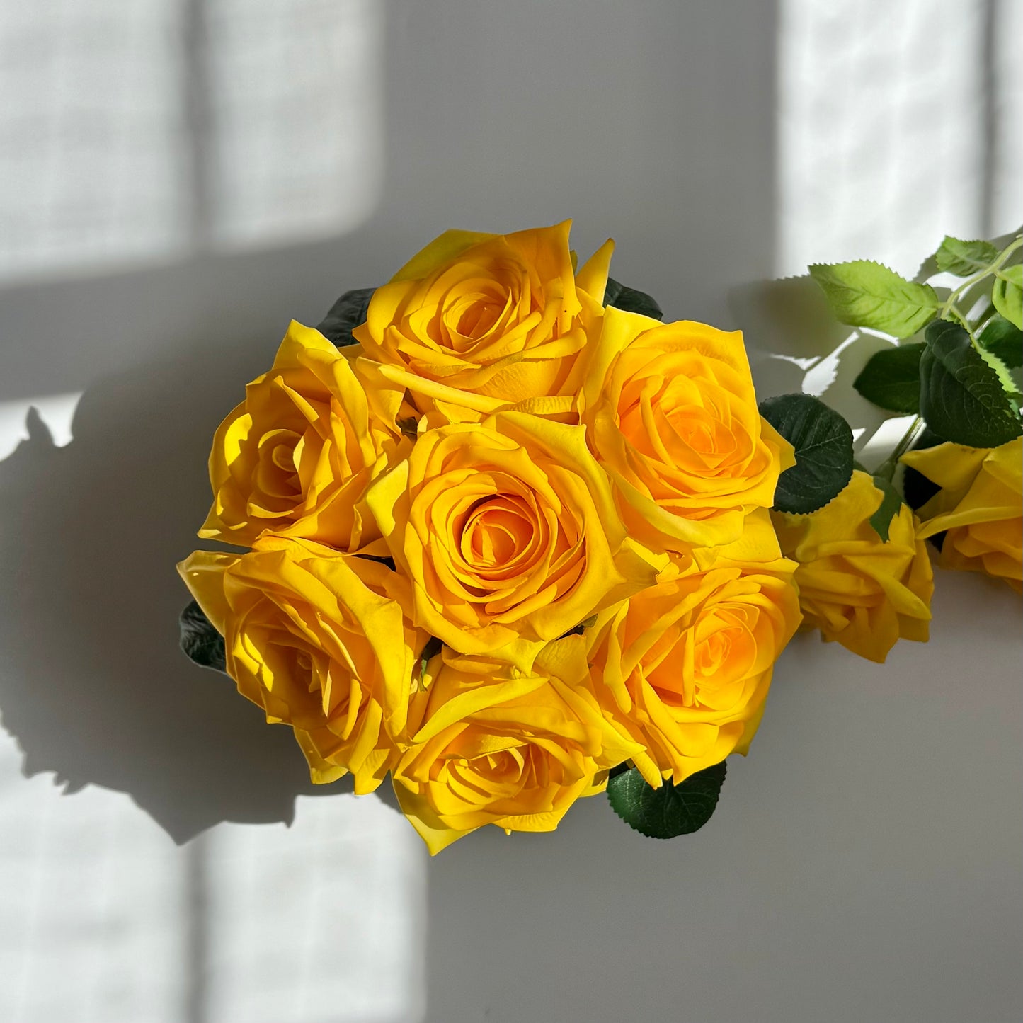 Bouquet of yellow roses on a white background