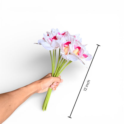 Hand holding a bouquet of artificial flowers with a measurement label indicating 12-inch length on a white background.
