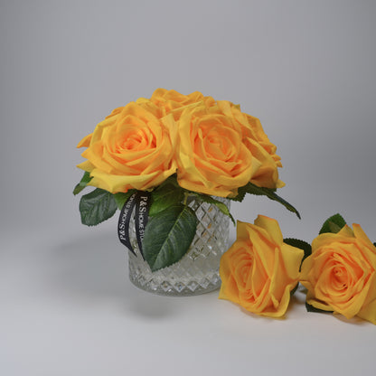 Real touch artificial flower stem yellow rose bouquet in glass vase set in resin illusion water.