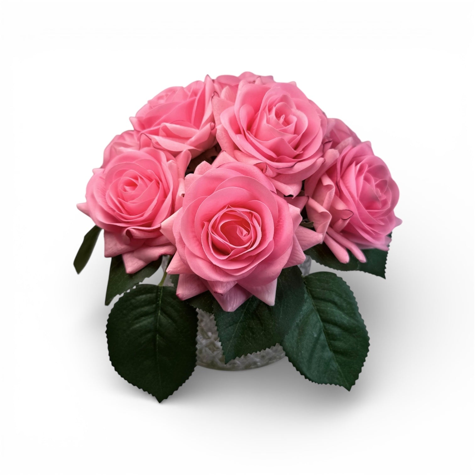 Bouquet of pink roses with green leaves on a white background