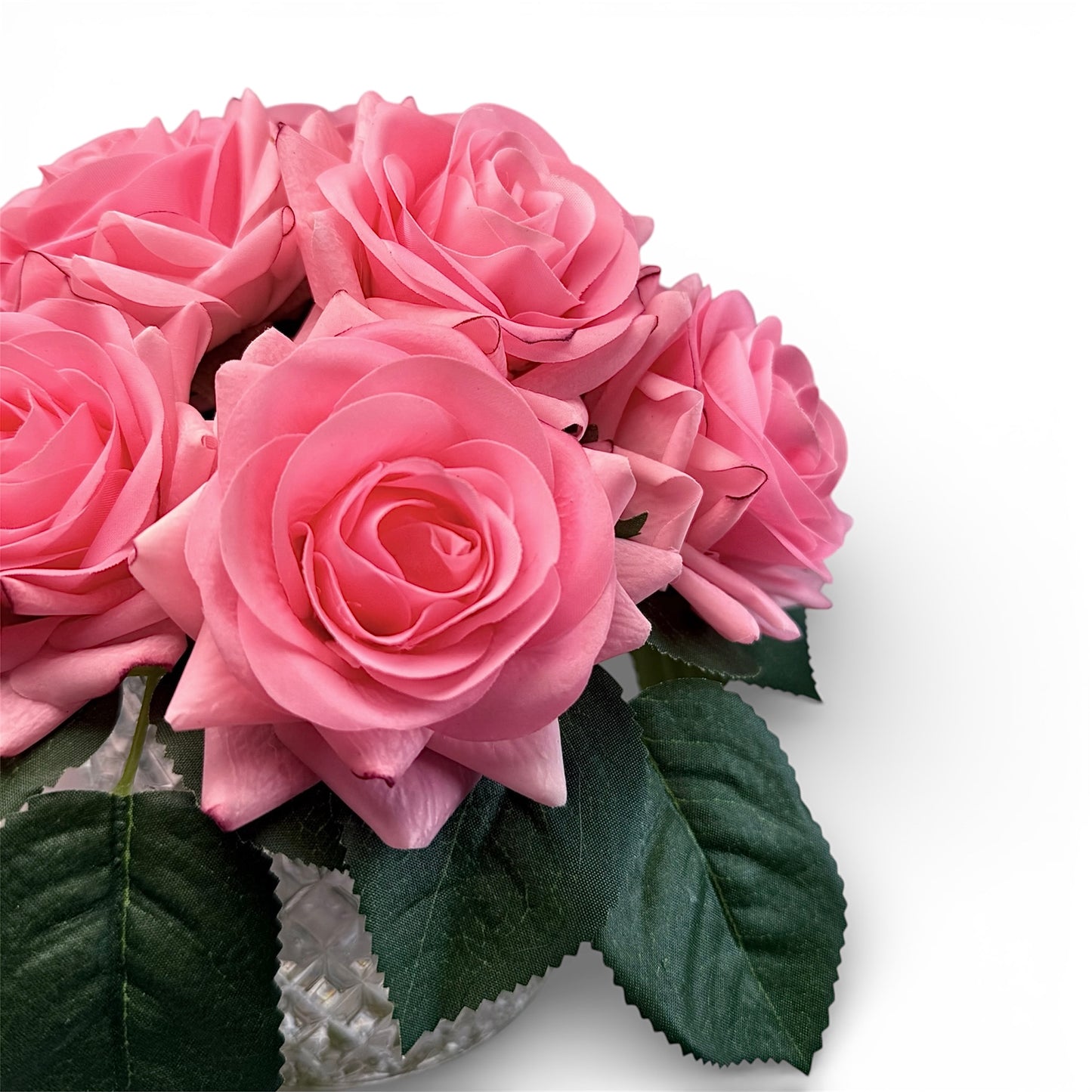 Bouquet of pink roses with green leaves on a white background